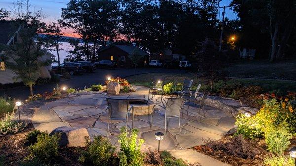 Fire-pit with stone patio behind the Lakefront Grand Chalet.