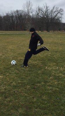 Masan practicing his soccer  skills