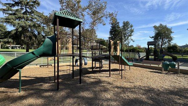 Big kid playground with wood chips