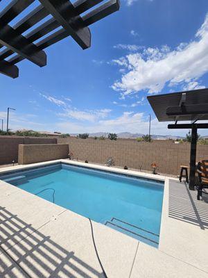 Finished product with Pool, Equipment Wall and two Pergerla's, one 12X12 and the other 6X22. The backyard is so enjoyable now.