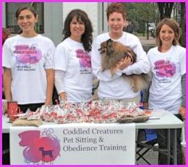 Some of Coddled Creatures Pet Sitting's fabulous Pet Care Specialists posing for a photo op at a local town event!