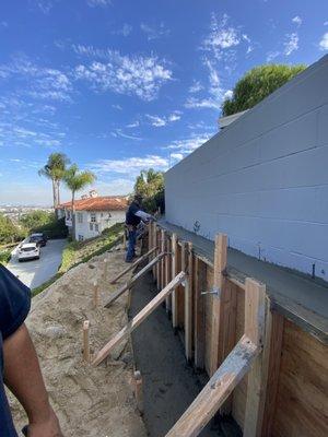 Letting wall dry before stripping forms