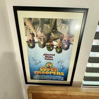 Signed super troopers poster.