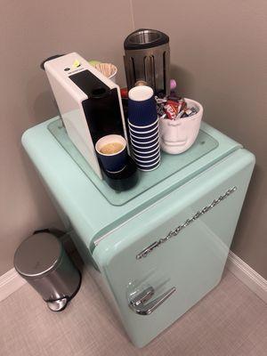 Mini fridge with water and Nespresso available while you wait in lobby