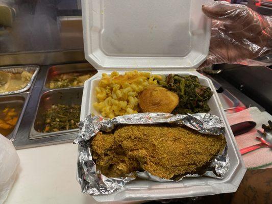 Fried catfish fillet macaroni and cheese turn up and mustard greens cornbread muffin