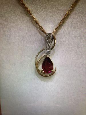 hand made 14k y/w gold pendant set with pink tourmaline and diamonds.