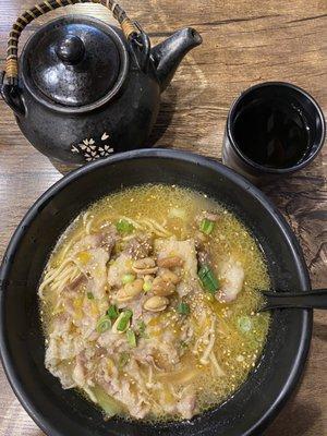 Sliced beef and enoki mushroom in sour pickle soup noodle