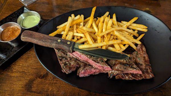 Carne y Papas
 Grilled skirt steak served with twice fried french fries and a trio of sauce (llajua, lime cilantro aioli, and chimichurri)