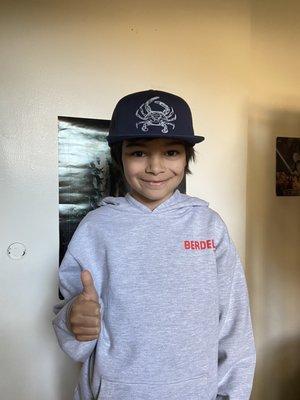 Berdel's sweatshirt size youth medium, and Uroko crab hat on my 8 year old.