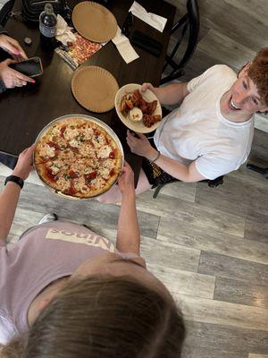 Serving Personal Margherita Pizza with a smile