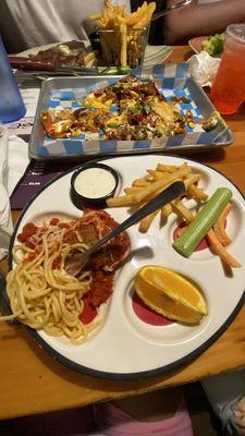 Spaghetti with meatballs, steak and fries, chicken lettuce wraps, loaded nacho brisket chips.