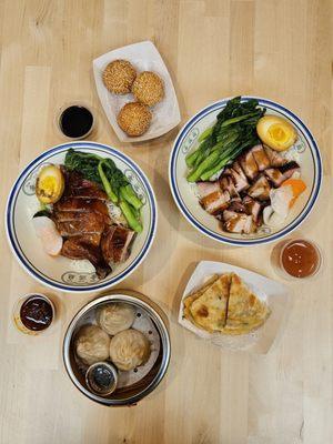 Roast duck and crispy pork belly over rice, pork and crab dumplings, sesame balls with lotus paste, and scallion pancakes