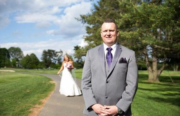 A first look focused on the groom on the golf course Www.jennifermchughphotography.com