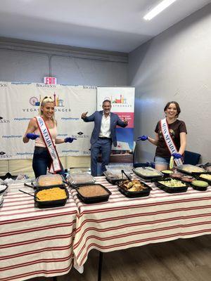 Mrs. Nevada and Miss Nevada helping feed our clients!