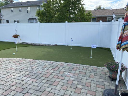 A small putting green adds big time enjoyment right off the back patio and a maintenance free yard makes it even better!