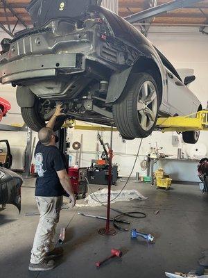 Best Muffler staff working on my Camaro SS