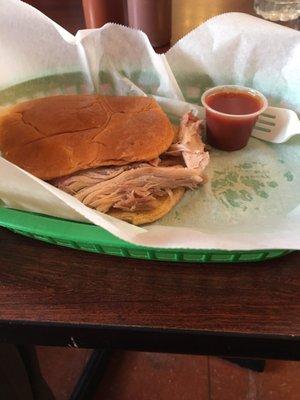 Large BBQ pork sandwich minus slaw sauce on side.