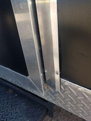 Sheared off rivets on door trim.