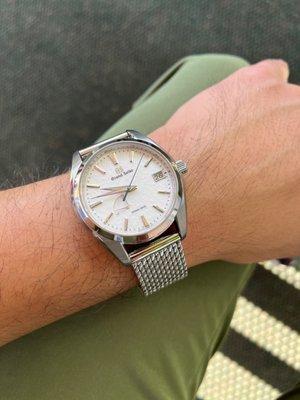 Grand Seiko Snowflake SBGA211 on an aftermarket STAIB Milanese Bracelet. This watch is a strap monster!