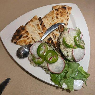 Grilled avocado appetizer with radish and jalapeno slices - very unique and very tasty!