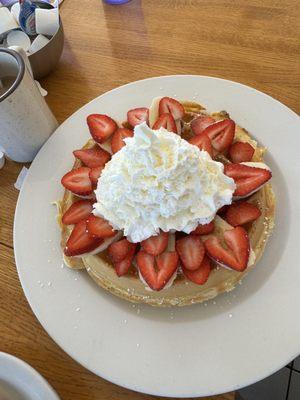 Belgian waffle w banana and strawberries topped with whip