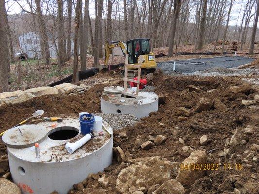 Installing 2-1000 gallon septic tanks in Flanders.