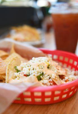 Shrimp Taco;
Beer-battered fish, avocado, pickled onion, queso fresco & salsa blanca