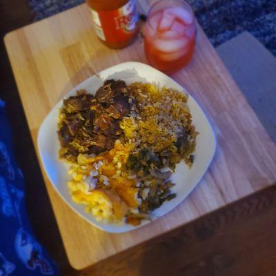 Ox tails yellow  rice greens and cabbage..