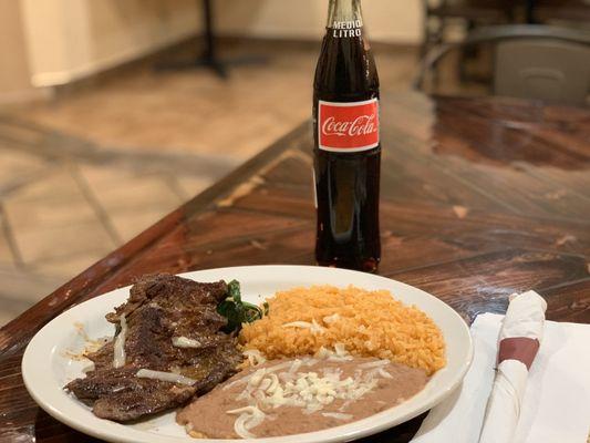 Poblano Asada- Jack Cheese, Shrimp and Spinach Stuffed Poblano Pepper Wrapped with a Fire Charred Skirt Steak. Served with Rice & Beans.