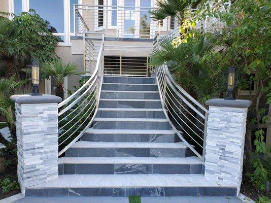 Tile Steps with stone columns and lighting for detail!