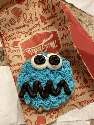 Cookie Monster missing the cookie in its mouth