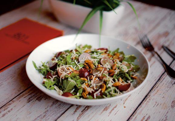 Summer Salad - arugula, toasted pistachios, red grapes, grated asiago cheese, poppy seed dressing