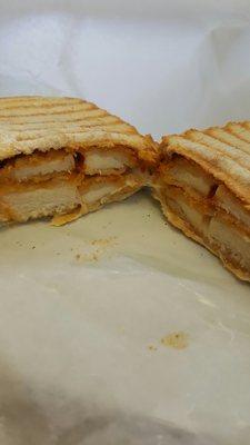 Chicken parm panini on scali bread.