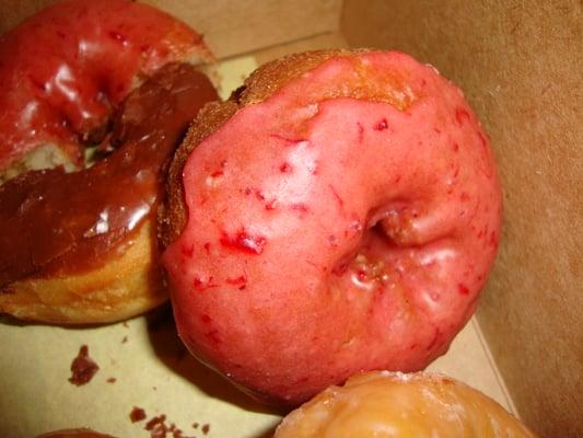 Glazed with Raspberry of some kind Donuts up close from Marty's 47th Street Donuts.  March 7th 2014.