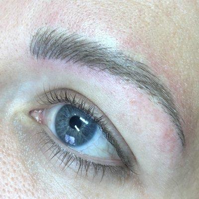 Microblading to cover up previous work.