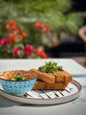 Golden crispy and 'cheesy' tofu sticks with homemade marinara.
 Vegan and GF