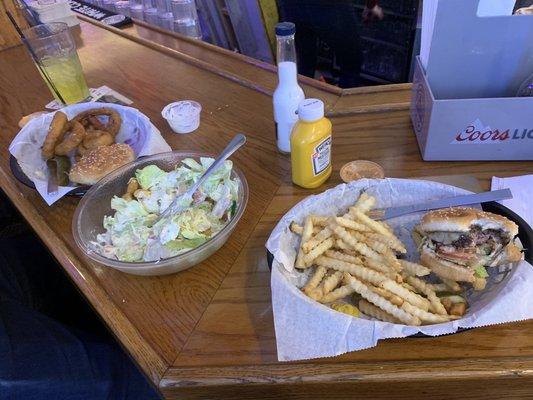 Two 1/4lb Burgers, one with fries one with onion rings. The House Salad.