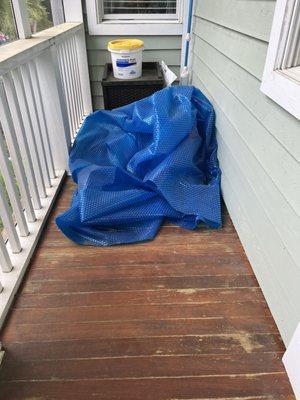 Pool cover was in the corner of the deck with mildew and had a terrible terrible smell. Also pool supplies sitting out in our space.