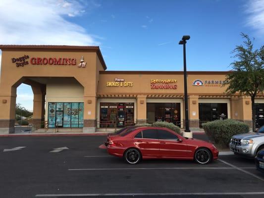 Exterior storefront and its neighbors.