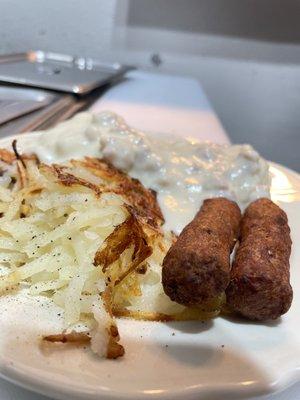 Biscuits and gravy with a side of sausage and a side of hash browns!