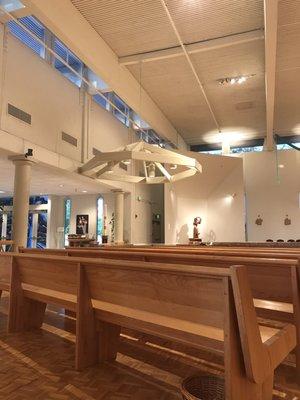 Bright interior, very inviting (view towards entrance & baptismal font)