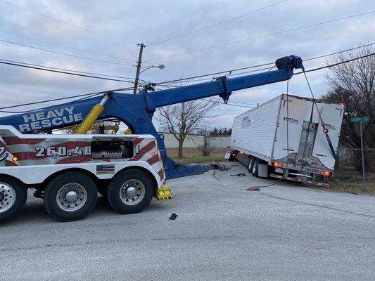 Trailer in ditch needs a little lift.