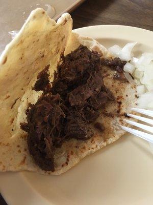 Barbacoa taco. Taste better than it looks .