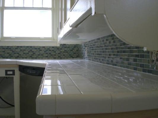 Newly tiled kitchen counter top and back splash.  This Seattle home was featured on HGTV's House Hunters