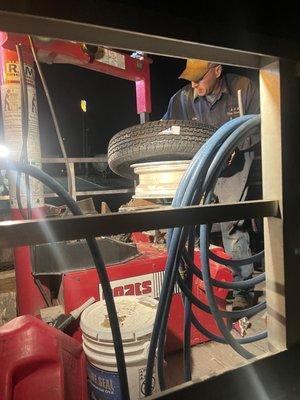 The guys working on replacing the tires on site.