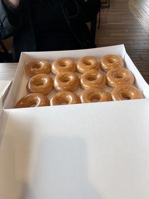 Dozen hot glazed donuts