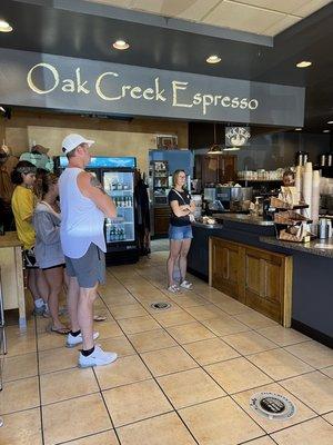 Waiting area ther has retail selections and fresh roasted beans to purchase.