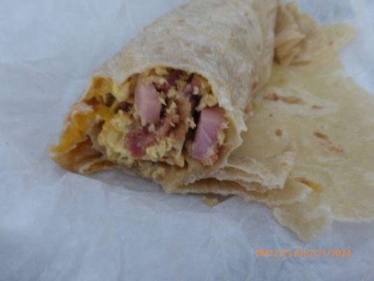 Inside of 3 Locos Burrito, Bacon, Ham, Sausage, egg, Pico De Gallo.