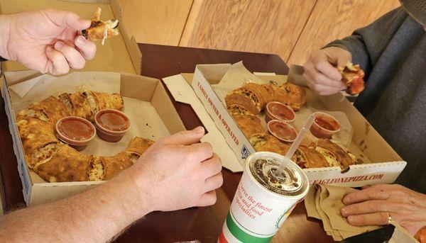 Huge calzones. The right is a large and will feed 3 people. The left is a regular and will easily feed 2 people.