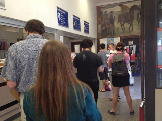 Average long line, with just one person working, at the post office on SE 7th